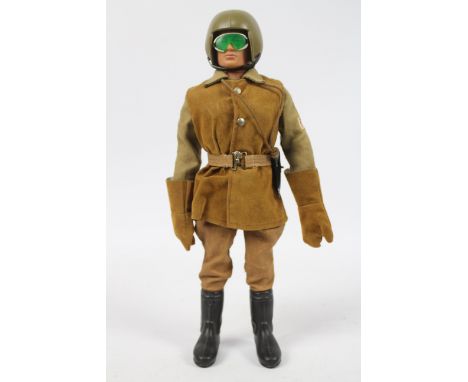 Palitoy, Action Man - A Palitoy Action Man figure in Despatch Rider outfit. The dark brown flock haired figure with gripping 