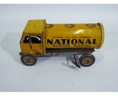 Mettoy - A rare clockwork tinplate Tanker in National Benzole Mixture livery. The model measures approximately 17 cm long. Th