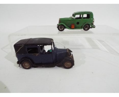 Tri-ang - Minic - 2 x clockwork pressed metal Minic vehicles, a Ford Y Saloon and a London Taxi. Both have working motors but