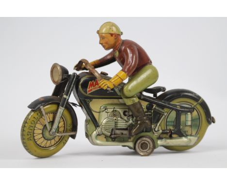 Arnold - A rare Arnold Mac 700 clockwork tinplate Motorcycle made in the US Zone Germany measuring 20 cm long. The motor work