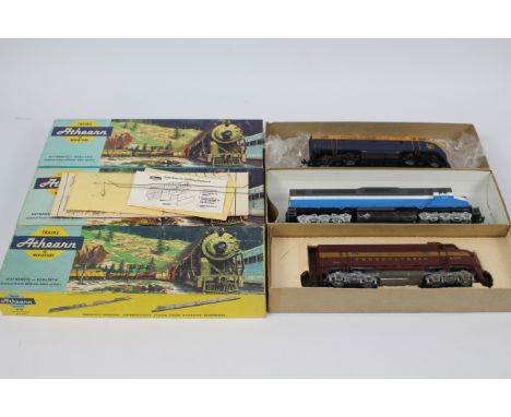 Athearn - 3 x boxed HO gauge locos, a GM EMD SDP-40 in Great Northern colours # 4105, a GM EMD F7A Diesel in Pennsylvania Rai