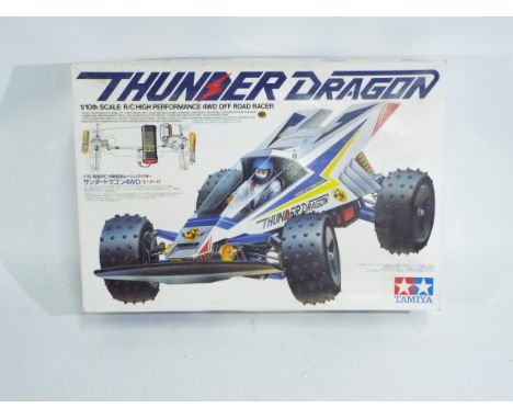 Tamiya - A boxed 1/10 scale Tamiya 'Thunder Dragon' R/C car - R/C car comes in an excellent-conditioned #58073 box. R/C car a