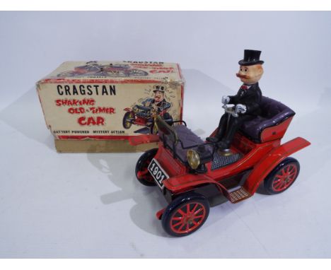 Cragstan - A boxed Japanese Cragstan Shaking Old-Timer Car # 2511-1. The battery powered model appears in Very Good condition