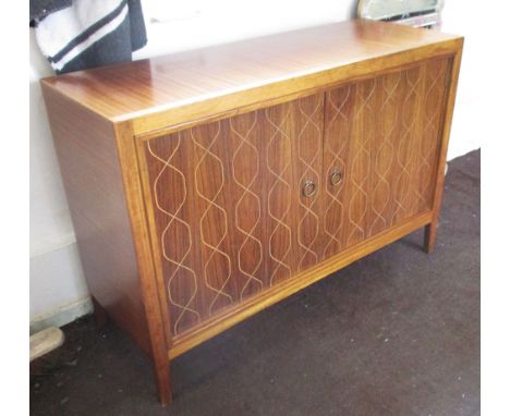 GORDON RUSSELL SIDE CABINET, by David Booth and Jude Ledeboer for Gordon Russell with two incised panel doors enclosing one s