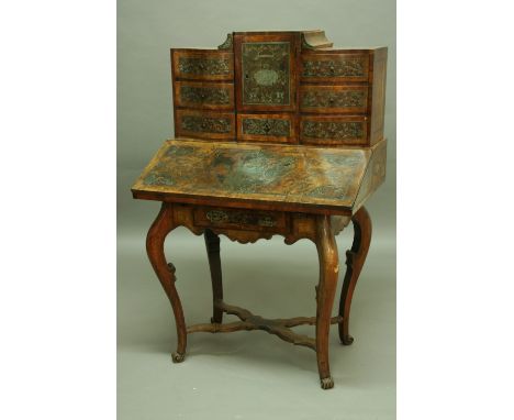 A GERMAN INLAID WALNUT BUREAU the superstructure with shaped drawers, inlaid in brass and pewter with scrolls and central pan