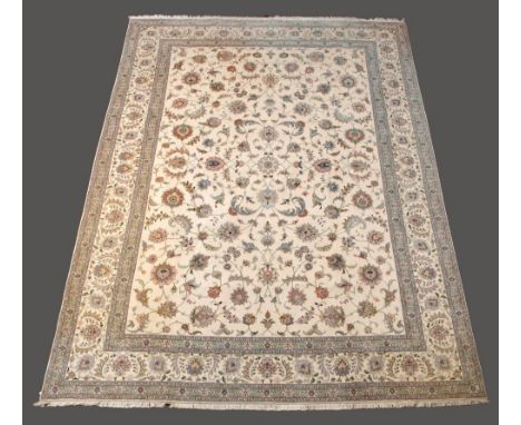 A CARPET  in beige, pale blue and green with scrolling floral field, three main borders :  11’ 6.5” (352 cms)  x  8’ 4” (253 