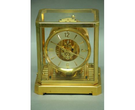 A LE COULTRE ATMOS MANTEL CLOCK with silvered chapter ring in brass and glazed case no. 17874 9.25" (23.5 cms) high