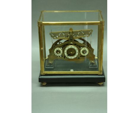 A TRIGONA 'ROLLING BALL' MANTEL CLOCK the brass frame with tilting platform above three enamelled dials showing hours, minute