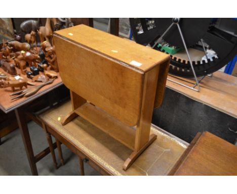 A light oak drop leaf table