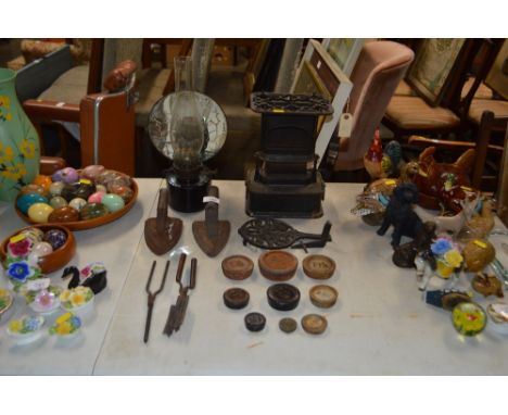 An oil lamp; two flat irons; a quantity of weights; hair curlers etc.