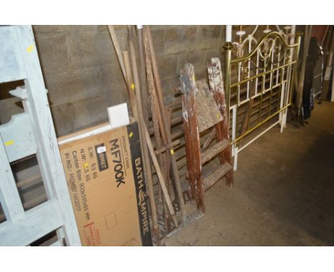 A bundle of long handled gardening tools