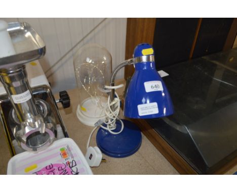 A desk lamp and a glass dome
