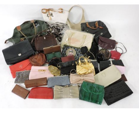 A collection of handbags, including DKNY, and vintage examples