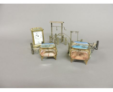 A brass carriage clock, with alarm, 12cm high, two Continental reverse printed caskets, and five silver plated garden impleme