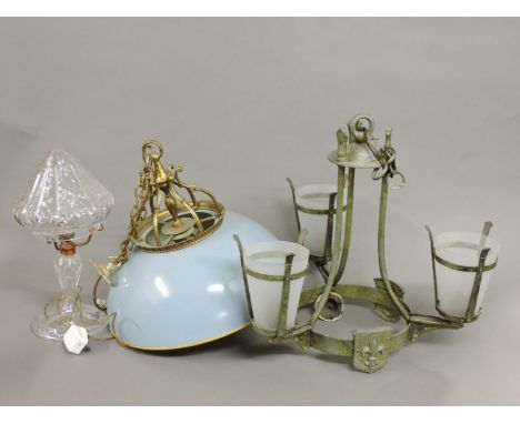 A three branch hanging light, a single light electrolier, and a glass table lamp and shade