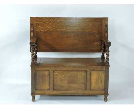 A 1920s oak monk's bench, 106cm wide