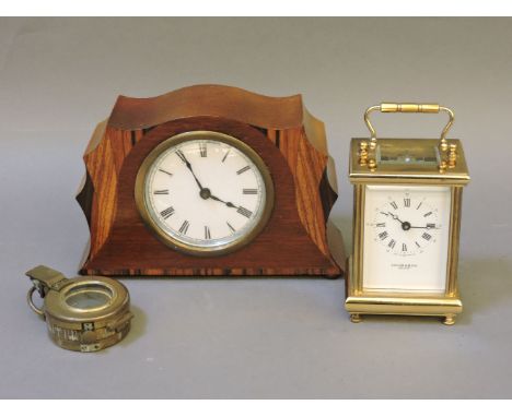 An Edwardian inlaid mantel clock, a Taylor & Bligh carriage clock, and a military compass