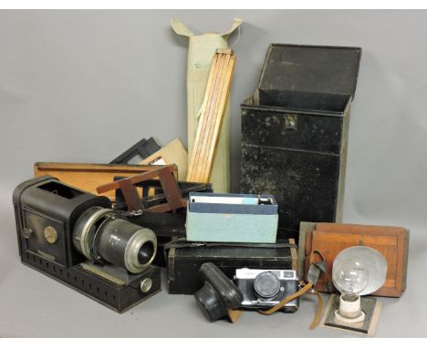 A tin magic lantern, three boxes of slides, two containing views of Switzerland, Austria and Bavaria, the other with Scottish