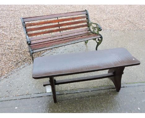 A cast iron and beech garden seat, and a wooden garden bench