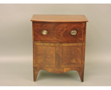 A George III strung mahogany bow front chest commode