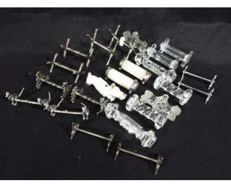 A collection of knife rests, predominantly pairs, to include silver and onyx examples, white metal, glass, ceramic.
Location 
