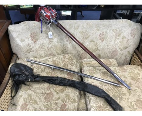 MILITARY DRESS SWORD WITH LEATHER SCABBARD, along with a further chrome scabbard and an outer bag, 105cm long overall