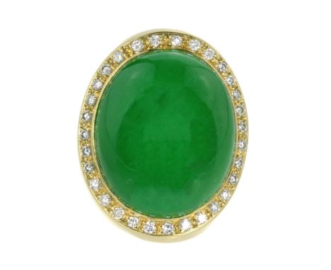 A JADEITE JADE AND DIAMOND COCKTAIL RING set with an oval cabochon jade of 65.4 carats, encircled by round brilliant cut diam