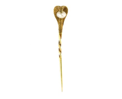 A PEARL COBRA / SNAKE STICK / TIE PIN designed as the head of a cobra atop a twisted pin, holding a pearl in its mouth, 5.6cm