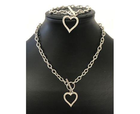 A matching belcher chain with t bar fixing and dangle heart necklace and bracelet. Both marked 925 with scales to fixings. Da