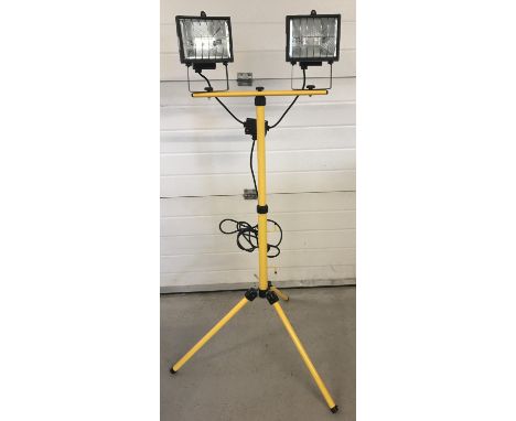 A modern metal framed freestanding set of workshop lights. Telescopic stand with tripod feet and adjustable light position. 