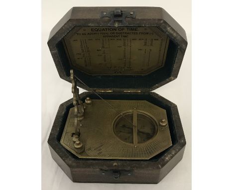 A wooden cased, brass octagonal shaped sundial compass, marked Gilbert &amp; Sons.  Box approx. 14.5cm long.