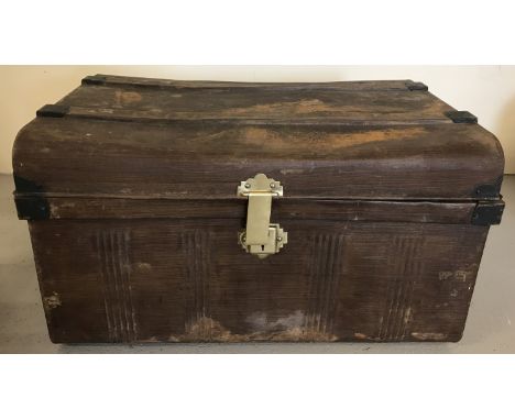 A vintage tin trunk with brass catch.  Approx. 70 x 45cm.