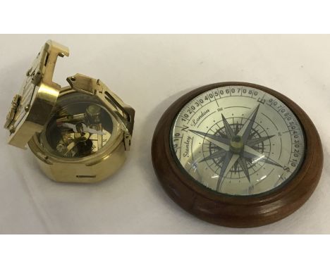 2 modern compasses. A brass cased Natural Sine compass, marked 'Stanley, London'. With mirrored lid to interior. Together wit