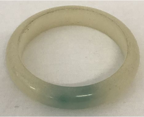 A Chinese Jade bangle.  Approx. 8cm diameter.
