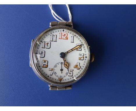 A WWI silver trench watch with white enamel dial luminous hands and traces of luminous paint remaining on hour numerals, subs