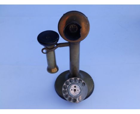 A vintage brass pedestal style telephone, 13" high - a/f.