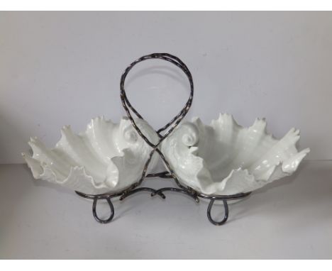 A matched pair of Royal Worcester Grainger &amp; Co. white moulded porcelain shell bowls on EP stand, each bowl 6.8" across.