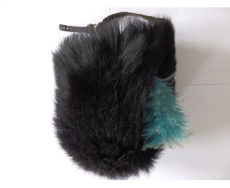 A vintage Irish Guards bearskin with curb chain.