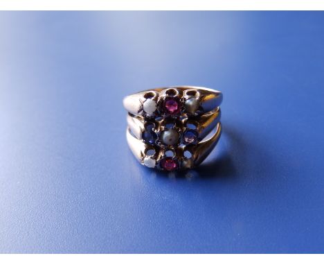 An Edwardian three tier 9ct gold ring, comprising three conjoined bands each set with three small alternating seed pearls wit