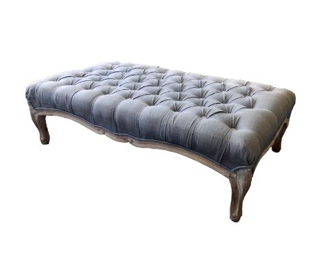 A large 20thC reproduction button upholstered stool, on cabriole feet,  47" x 27".