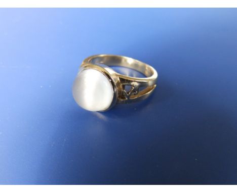 A '9k' moonstone ring - 'M&amp;M'.  Finger size O.