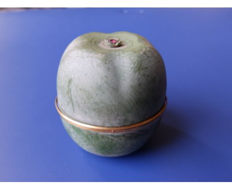 A late 19th/early 20thC Child &amp; Child green-stained ivory ring box in the form of an apple, having a small ruby inset to 