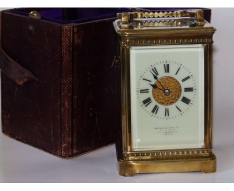 A French brass striking carriage clock in case, with spiral gong, retailed by Howell &amp; James,  5.6" excluding handle.