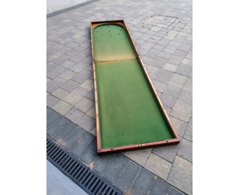 A Victorian folding mahogany table top bagatelle board, 96" overall.