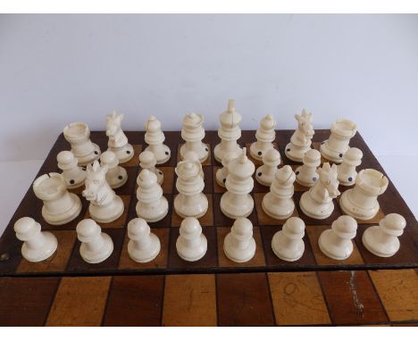 A 19thC ivory chess set, all self coloured, having only ebonised spots to differentiate opposing sides,  the kings 2.3", toge