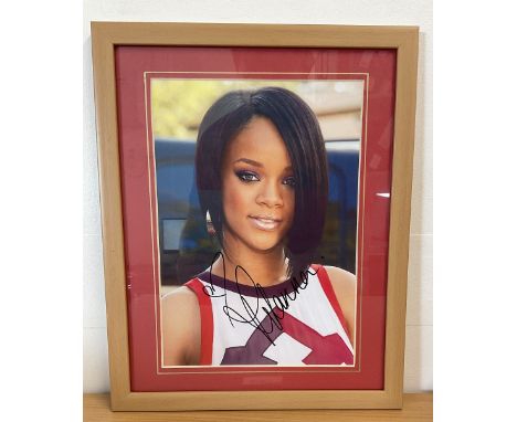Rihanna signed 16x12 overall mounted and framed colour photo. Robyn Rihanna Fenty NH (born February 20, 1988)is a Barbadian s