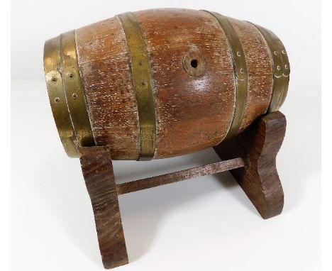 A coopered oak barrel with brass fittings &amp; stand inscribed Poole Pin Trophy 1955-1958 