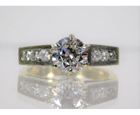 An 18ct gold ring set with in excess of 1ct of diamond