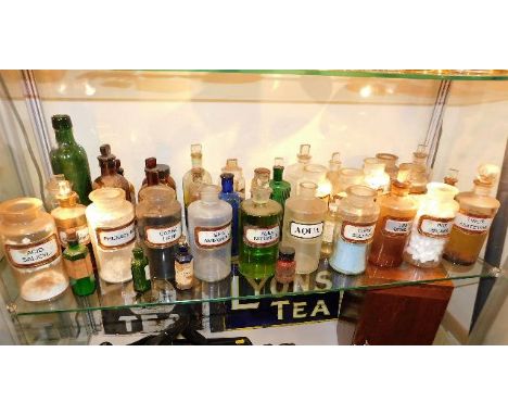 A quantity of mostly chemists, medicine &amp; poison bottles, contents of shelf