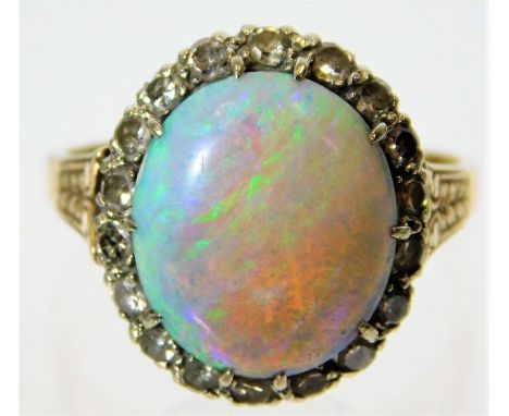 A 14ct gold ring set with opal &amp; approx. 0.6ct of diamond 4.5g size P
